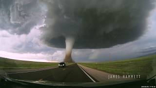 Storm chasing dashcam Tornado crossing the highway Laramie Wyoming [upl. by Ecyal645]