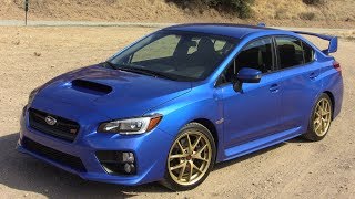 2015 Subaru WRX STI First Drive Review [upl. by Enelrac576]